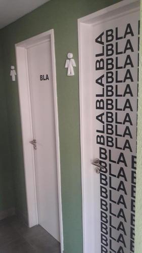 a room with a door with the words balaaba on the wall at Studio 44 in Belén de Escobar