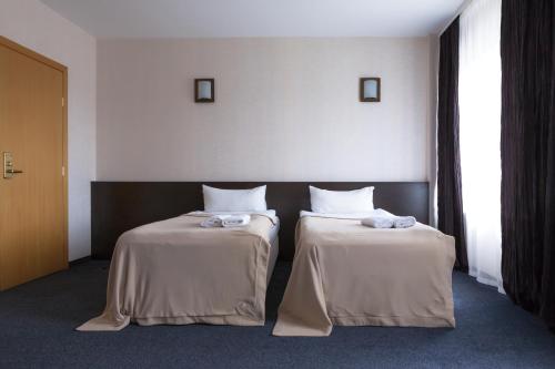 Una cama o camas en una habitación de Hotel Palma