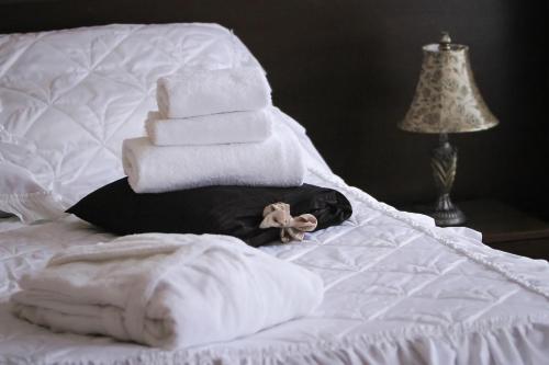 Una cama o camas en una habitación de Hotel Palma