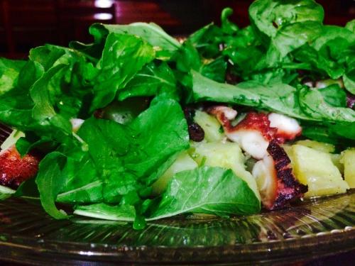 a plate of greens on top of a pizza at Pousada Kite Guajiru in Itarema