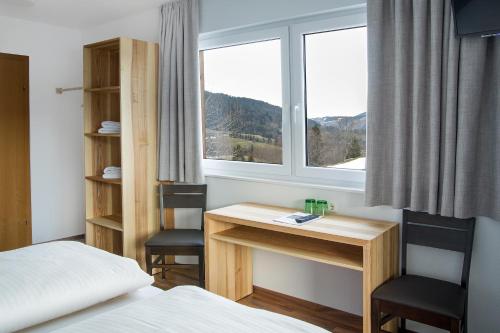 Postel nebo postele na pokoji v ubytování Panoramahotel Sonnhalde