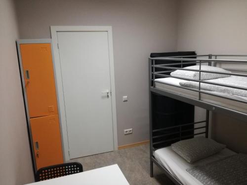 a room with two bunk beds and a mirror at Liberty Airy in Rīga