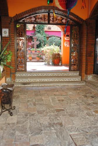 an entrance to a building with a stone floor at Hotel Boutique Posada la Casona de Cortés in Tlaxcala de Xicohténcatl