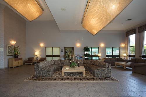 a large living room with couches and a table at Shilo Inn Portland Airport in Portland