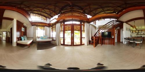 a room with a large room with a skateboard ramp in it at Sandy Feet Siargao in General Luna