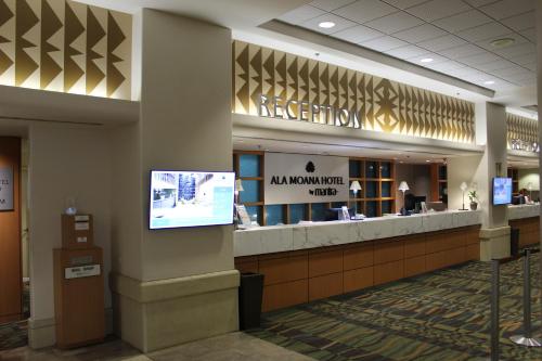 a lobby of a hotel with a reception counter at LSI Resorts at Ala Moana in Honolulu