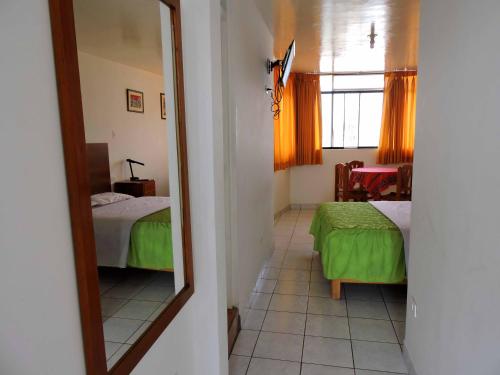 Ένα ή περισσότερα κρεβάτια σε δωμάτιο στο Hostal Miramar