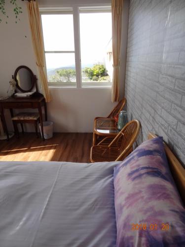 Postel nebo postele na pokoji v ubytování Shan Shui-Yuan Vege Guest House