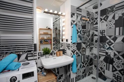 a bathroom with a sink and a mirror at Luxury apartment Spálená in Prague