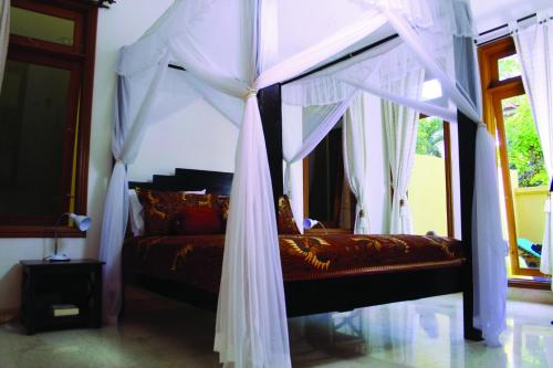 Lova arba lovos apgyvendinimo įstaigoje Villa Putu Mira By Maha Bali