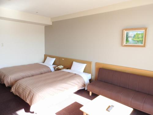Postel nebo postele na pokoji v ubytování Kai Resort Hotel