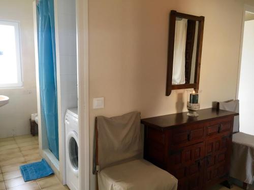 a bathroom with a washing machine and a mirror at Denia playa de Las Marinas, 4 personnes in Denia