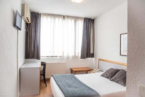 Postel nebo postele na pokoji v ubytování Hotel Prado Real