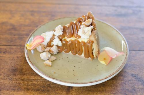 a piece of cake on a plate on a table at Summerfields Rose Retreat and Spa in Hazyview