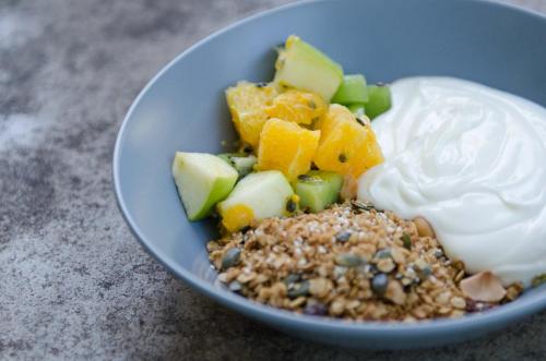 a blue bowl of food with fruit and whipped cream at Summerfields Rose Retreat and Spa in Hazyview