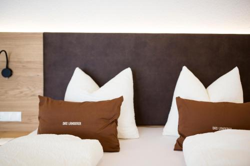 Uma cama ou camas num quarto em Das Landerer