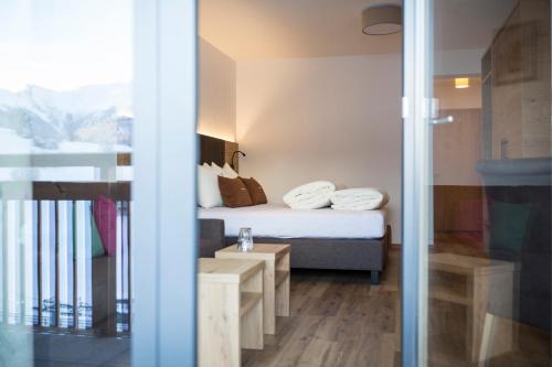 Uma cama ou camas num quarto em Das Landerer