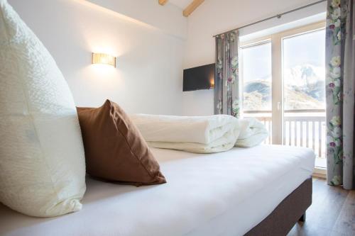 Uma cama ou camas num quarto em Das Landerer