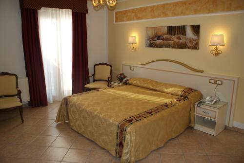 Vuode tai vuoteita majoituspaikassa Hotel Ristorante Borgo La Tana