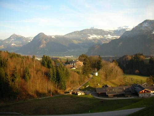 a view of a village with mountains in the background at Stangleggerhof in Wiesing