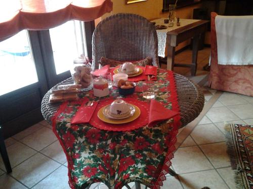 a table with a tea set on top of it at B&B Casa Dolce Casa in Candelo