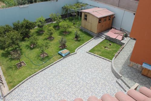 an aerial view of a backyard with a building at The House in Tacna