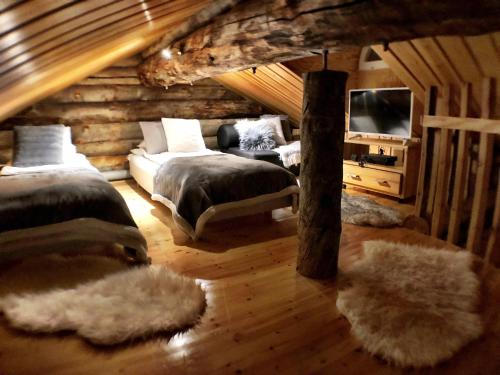 Ένα ή περισσότερα κρεβάτια σε δωμάτιο στο Ruka Chalet Oliver