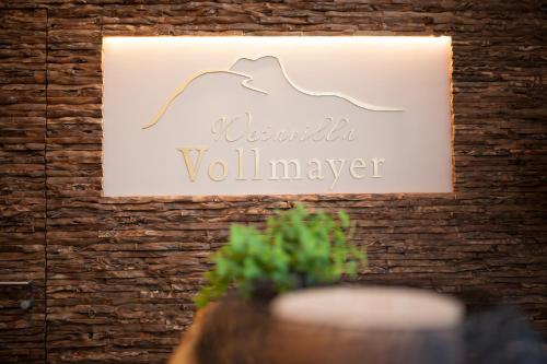 a sign on a wall that reads aquatic voluminayer at Weinvilla Vollmayer in Hilzingen