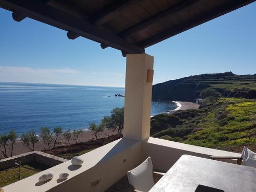 a view of the ocean from the balcony of a house at Almyra Kythera in Agia Pelagia Kythira