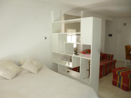 Tempat tidur dalam kamar di 1-1/2 AMB c/BALCON SOLEADO en EDIFICIO FRENTE AL MAR