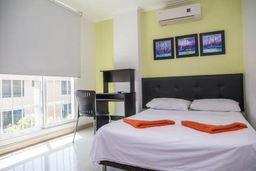 Cama o camas de una habitación en Hotel Rodadero Real