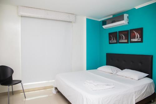 Cama o camas de una habitación en Hotel Rodadero Real