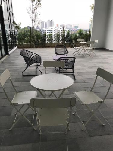 a group of chairs and tables on a patio at CBD3 SOHO in Cyberjaya