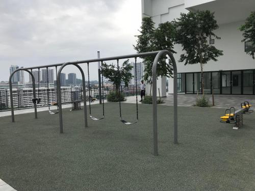 an empty playground with swings on a building at CBD3 SOHO in Cyberjaya