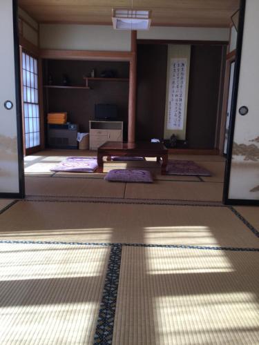 a room with a table in the middle of a room at Tobei in Nozawa Onsen