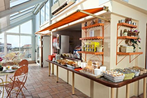 a kitchen with a counter with food on it at L'Esterel in Cannes