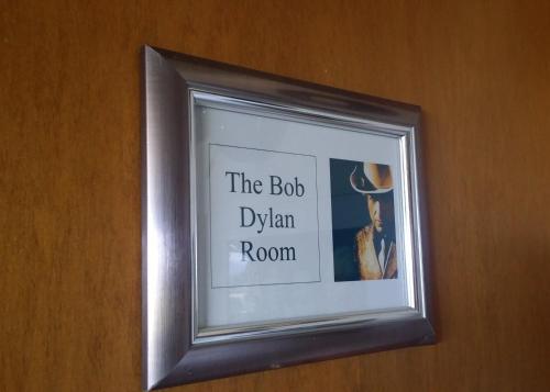 a framed picture of a woman in a room at High On Penguin in Penguin