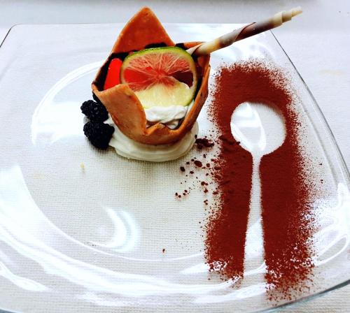 a plate with a dessert with the number on it at Hotel Antines in La Villa