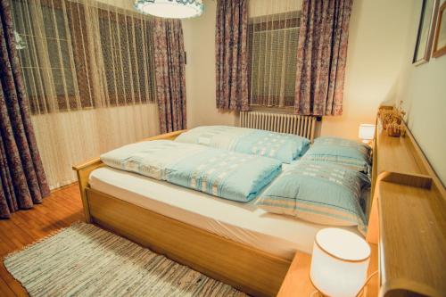 Postel nebo postele na pokoji v ubytování Appartements Tlusel