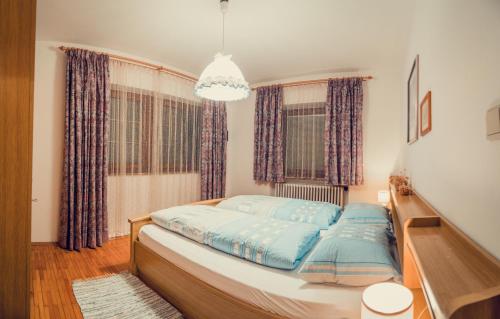 Postel nebo postele na pokoji v ubytování Appartements Tlusel