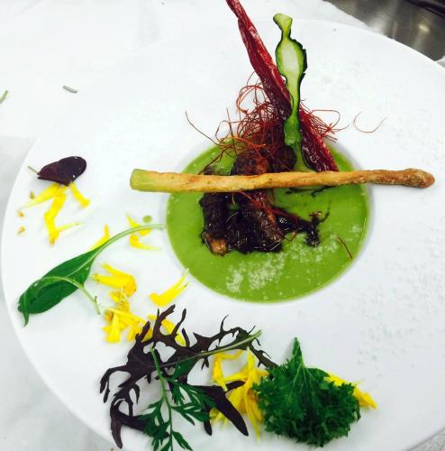 a white plate with a dish of food on it at Hotel Antines in La Villa