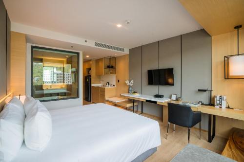 Cama o camas de una habitación en Arize Hotel Sri Racha