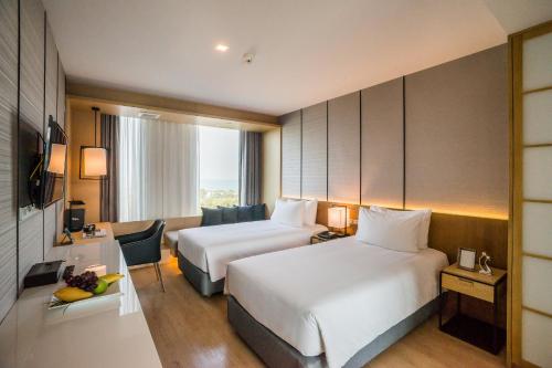 Cama o camas de una habitación en Arize Hotel Sri Racha