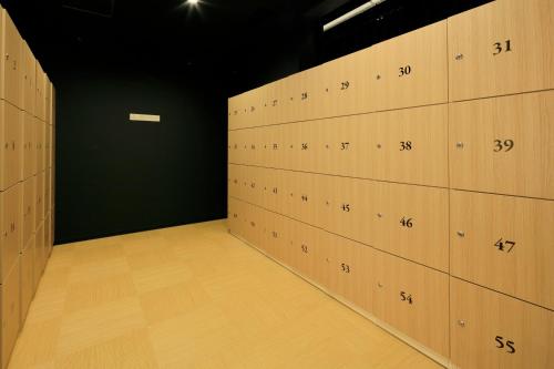 a row of lockers in a gym at THE SINGULARI HOTEL & SKYSPA at UNIVERSAL STUDIOS JAPAN in Osaka