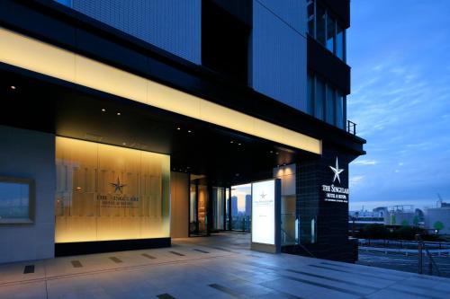a building with a sign on the side of it at THE SINGULARI HOTEL & SKYSPA at UNIVERSAL STUDIOS JAPAN in Osaka