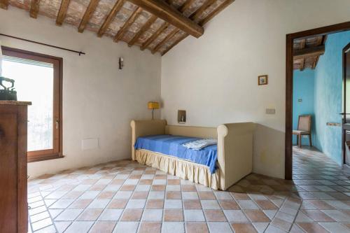 a bedroom with a bed in a room with a window at Agriturismo Il Poggio degli Scoiattoli in Perugia