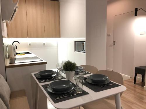 Virtuvė arba virtuvėlė apgyvendinimo įstaigoje Apartament Comfort Zone