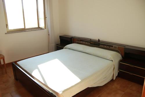 Appartamentino Gagliano del Capoにあるベッド