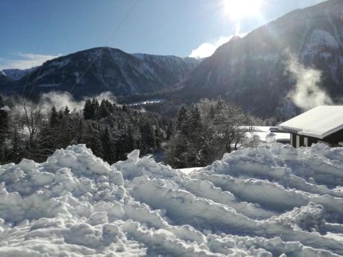 a pile of snow in front of a mountain at Birnbacher-appartement in Sankt Veit im Pongau