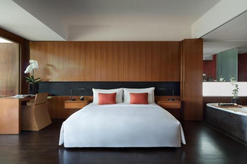 A bed or beds in a room at Anantara Chiang Mai Resort - SHA Extra Plus Certified